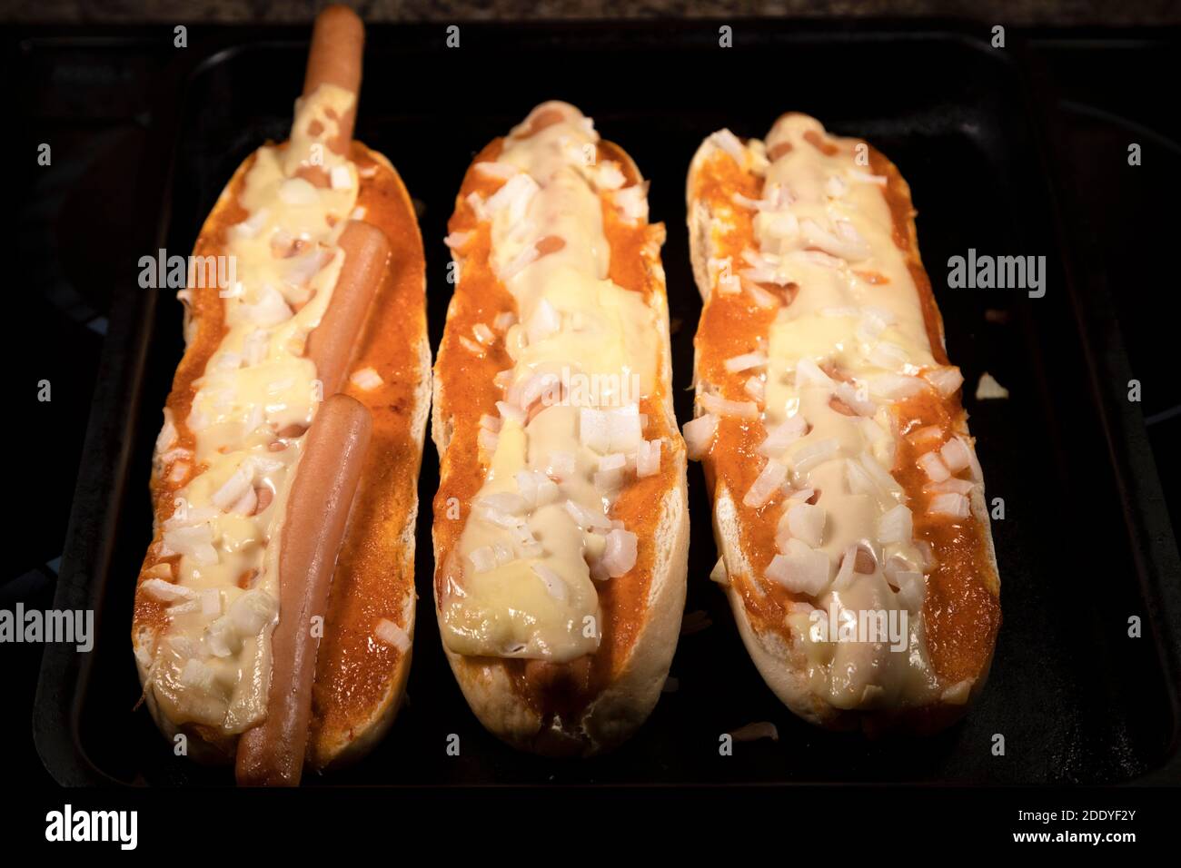 Spanish hot dogs fresh from the oven. Hot dogs have been placed in a