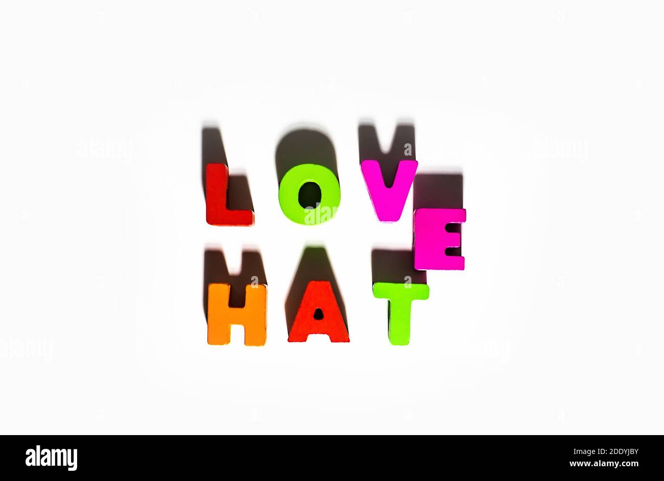 Love Hate words spelling by wooden colorful letters with common E and