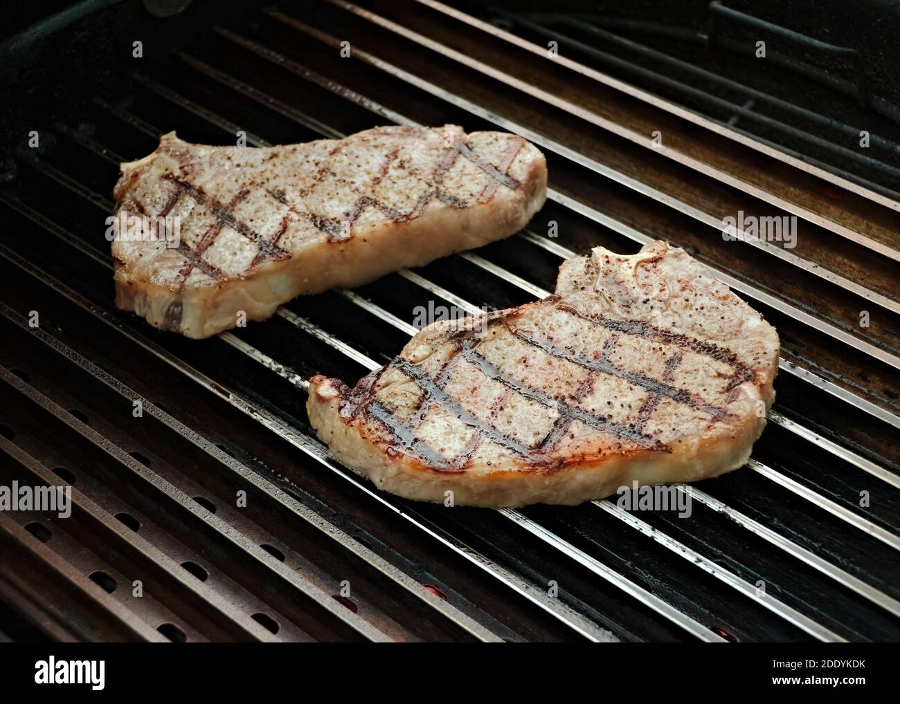 beef steaks on the grill New York Strip steaks Stock Photo Alamy