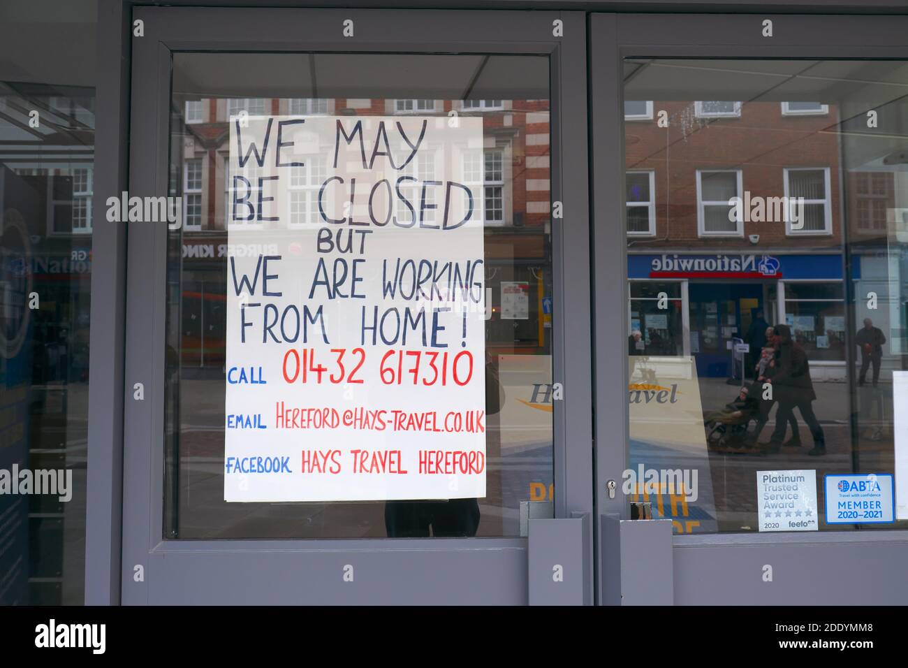 Coronavirus lockdown 2 - a branch of Hays travel agents closed as non essential with sign informing public that staff are working from home - Nov 2020 Stock Photo