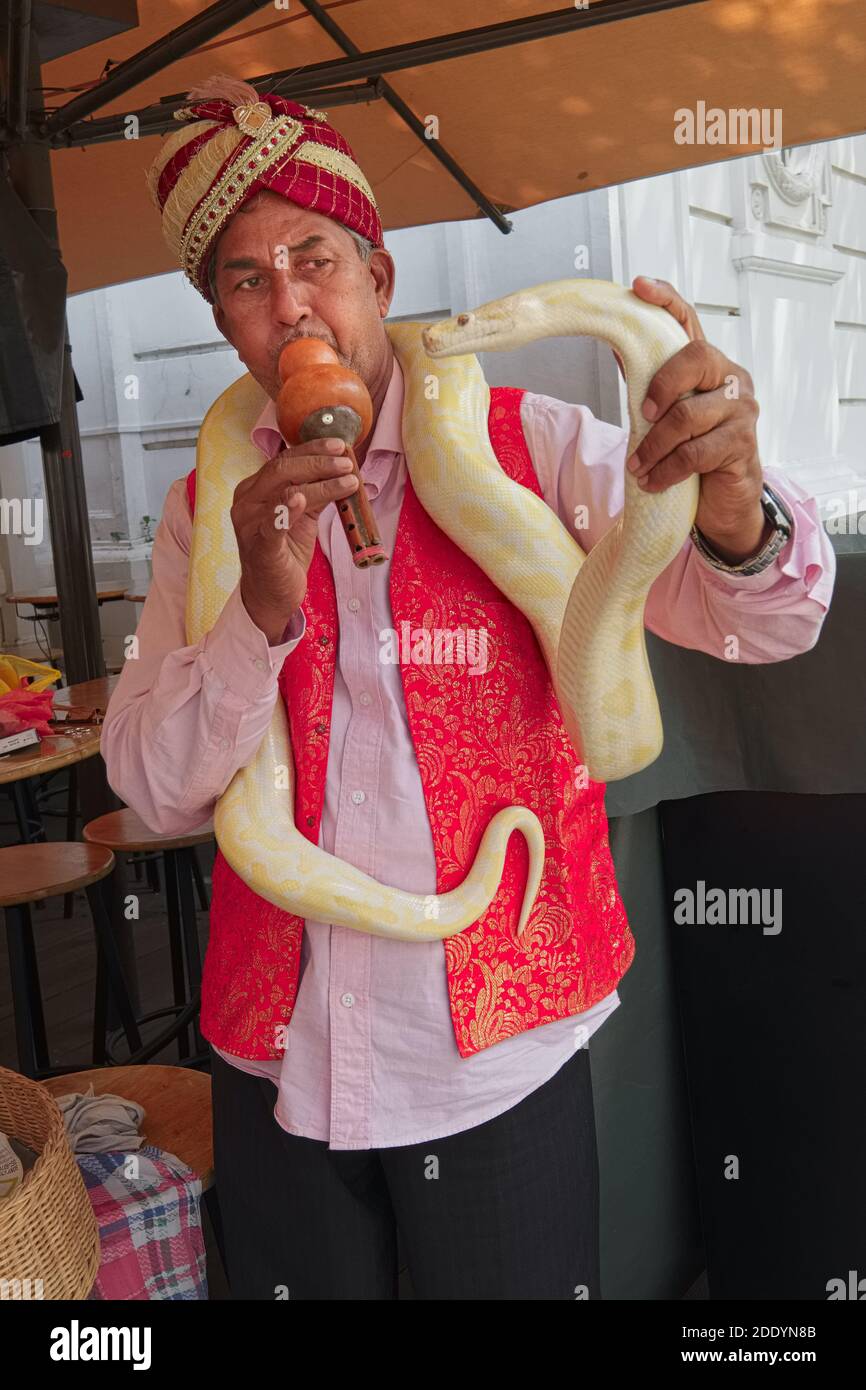 An ethnic Indian snake charmer in Singapore, usually entertaining ...