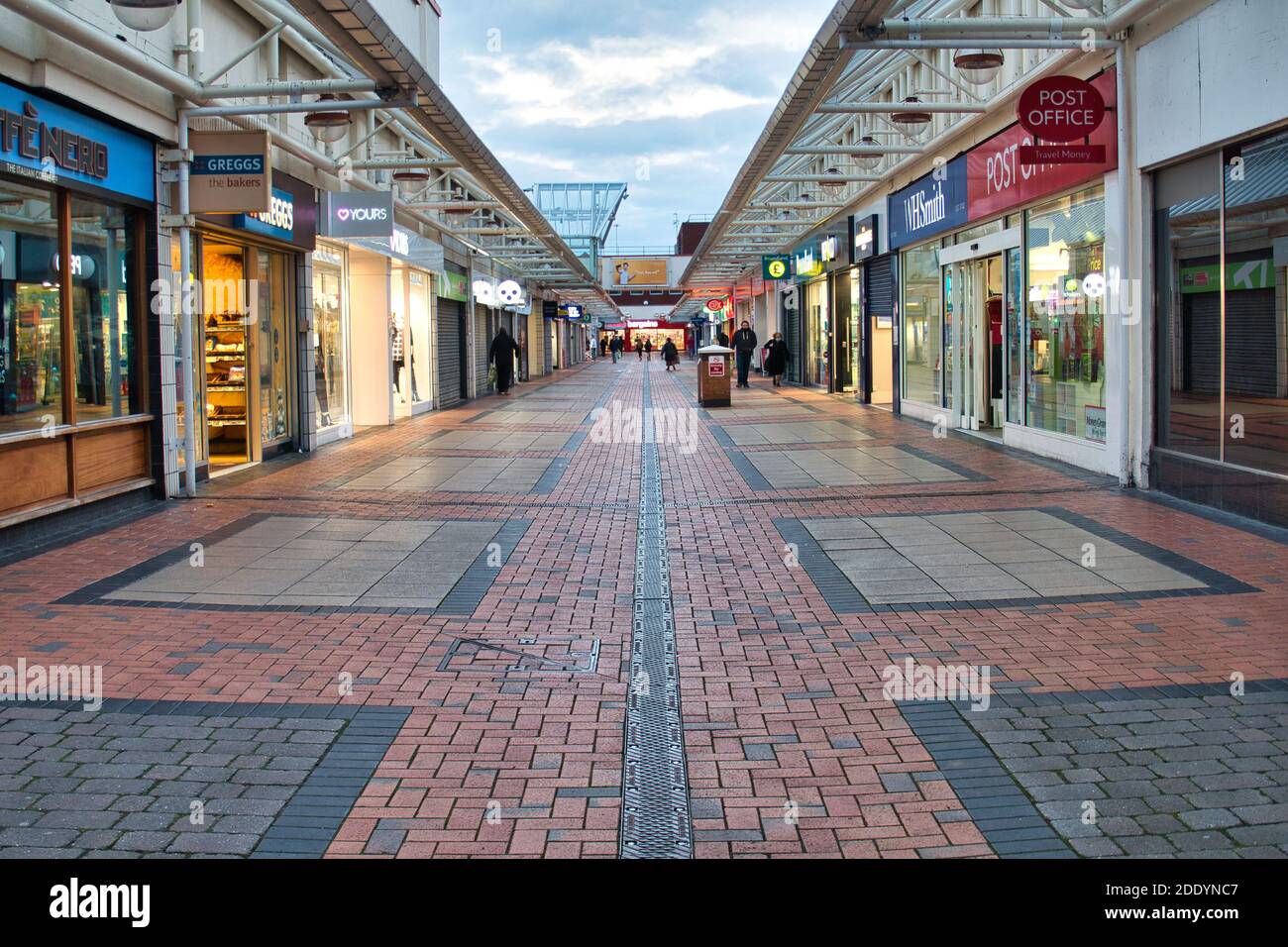 An almost deserted urban shopping mall pictured during the England autumn lockdown in November 2020. Essential shops are open, but most are closed. Stock Photo
