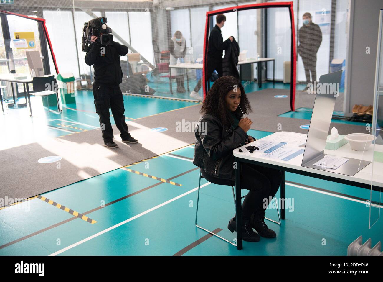Student Lorraine Gorimani is the first to get a Covid-19 test at a makeshift mass testing centre set up at the University of Northampton, ahead of mass testing on Monday for the Christmas holiday. Stock Photo