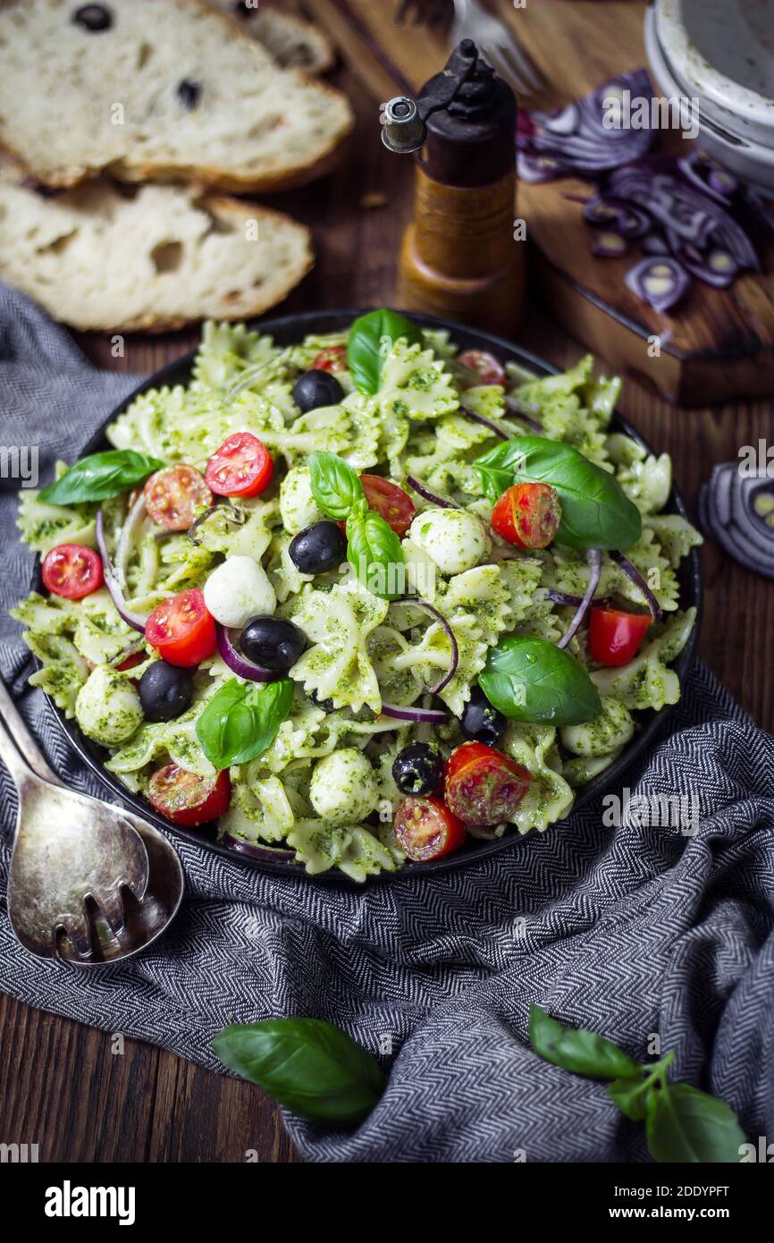 Pasta salad with arugula pesto and mozzarella. Italian cuisine Stock