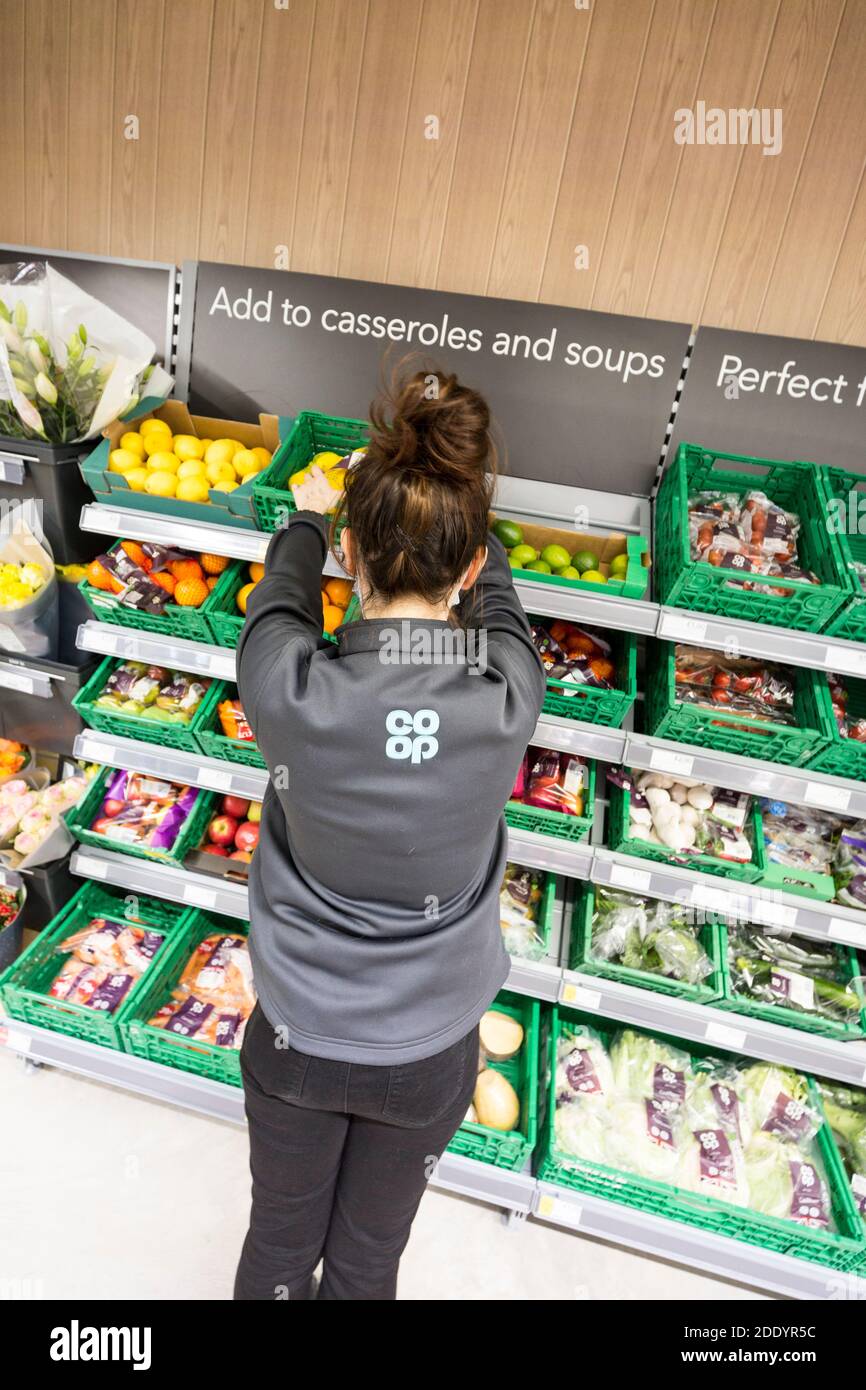 a woman working in a Co-Op food store Stock Photo