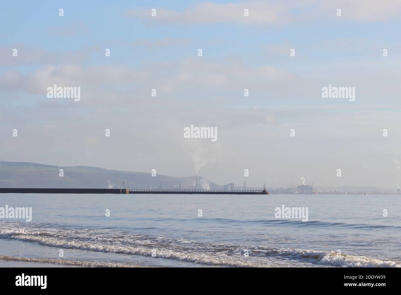 A photograph of Port Talbot steelworks from Swansea Bay beach on a clear cold day Stock Photo