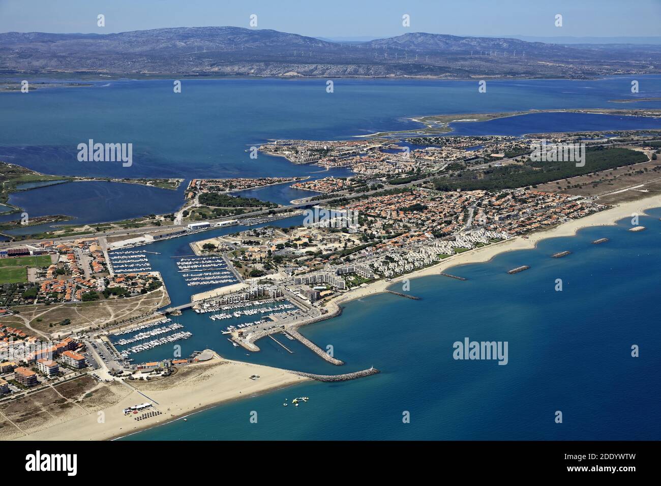 Le Barcares (south of France): aerial view of the seaside resort, the  marina, the pond of Leucate and the Corbieres mountain range Stock Photo -  Alamy
