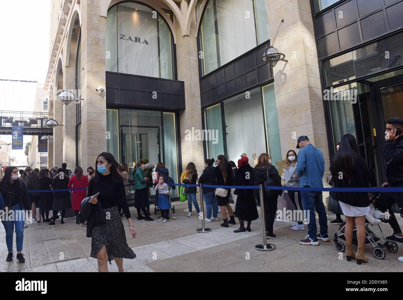 Israelis wait to enter ZARA because of COVID-19 restrictions on Black  Friday in Jerusalem, November 27, 2020. The coronavirus cabinet reopened  shopping centers and stores in spite of the rising daily infection