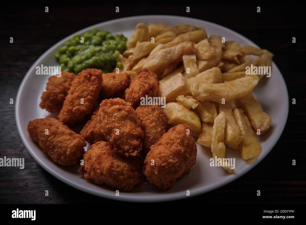 Scampi, chips and mushy peas, British classic fish and chips restaurant ...
