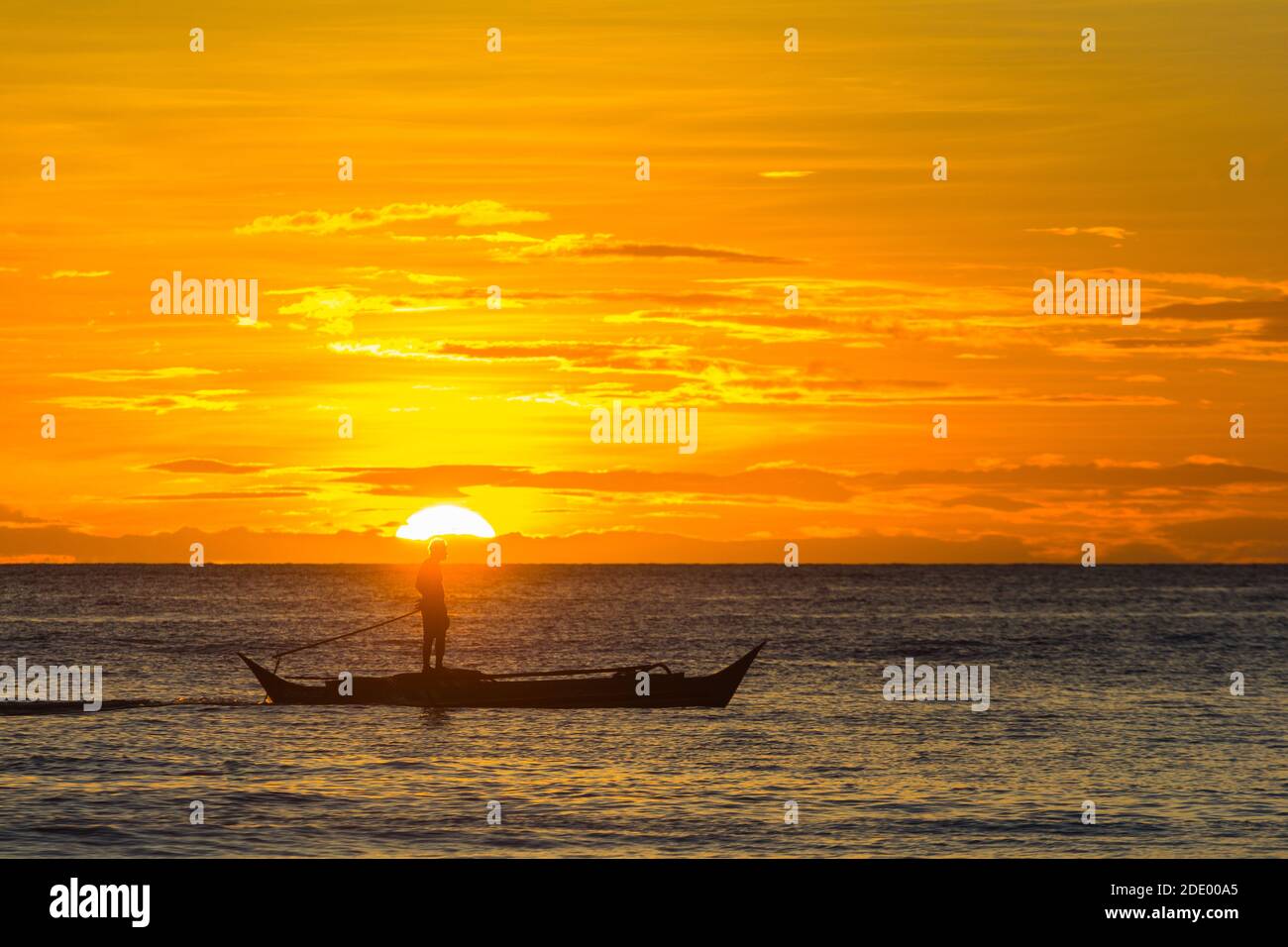 Paddle boarding during sunset in Boracay Island, Philippines Stock