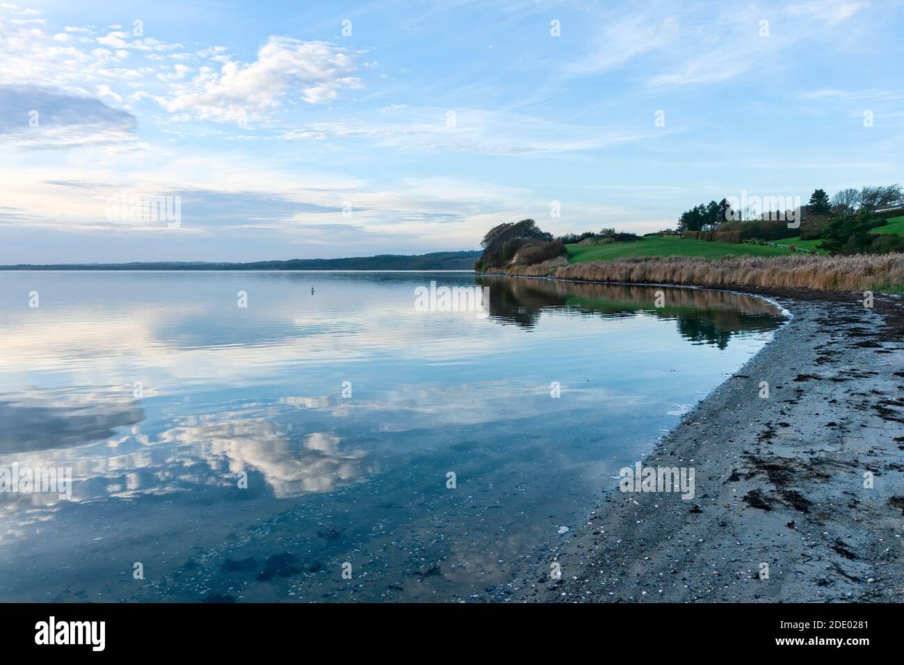 Reflection of clouds in the water at the inlet at Horsens, Denmark Stock Photo