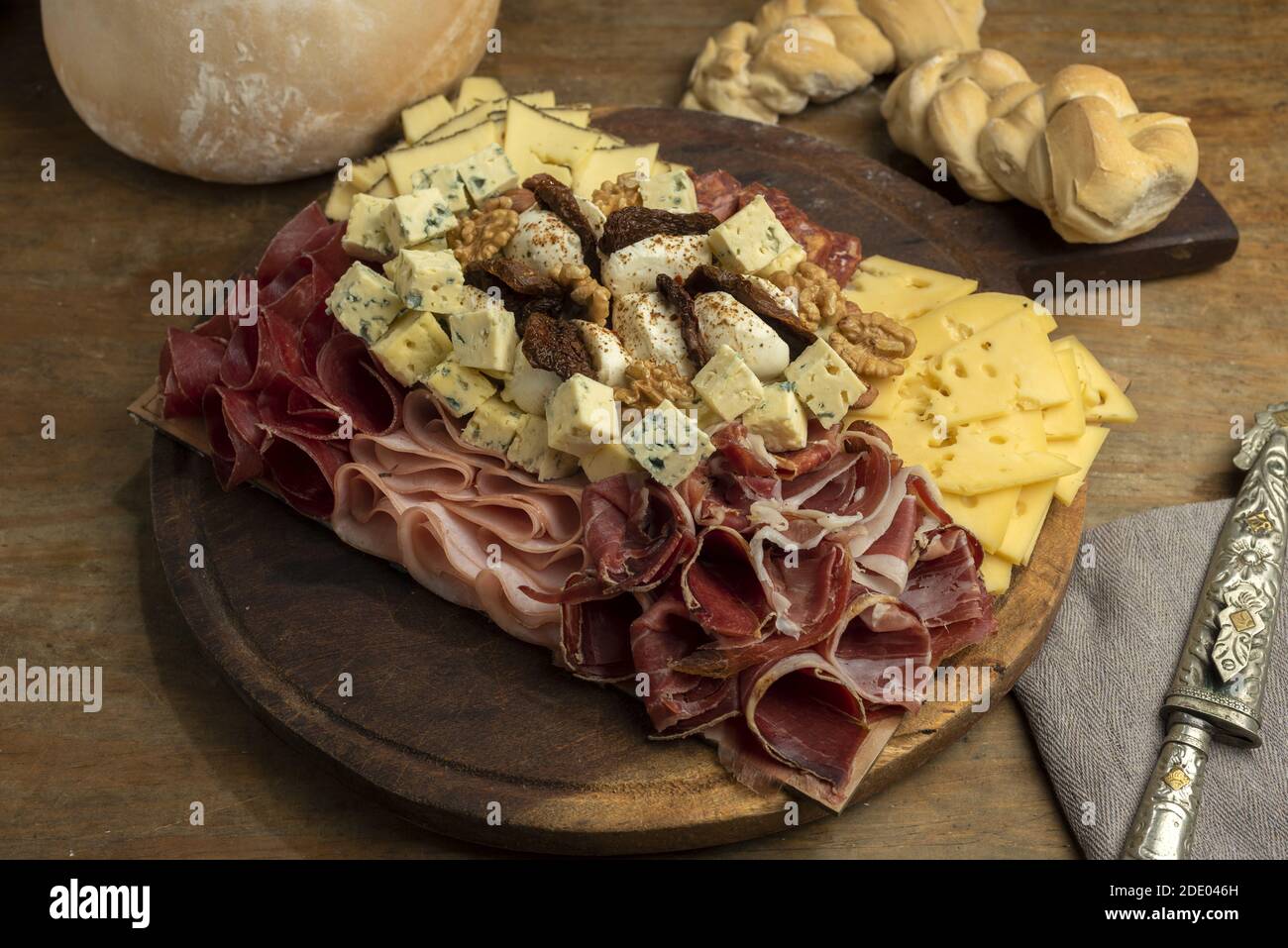 A high angle shot of a gourmet delicious charcuterie board with different meats and cheeses Stock Photo