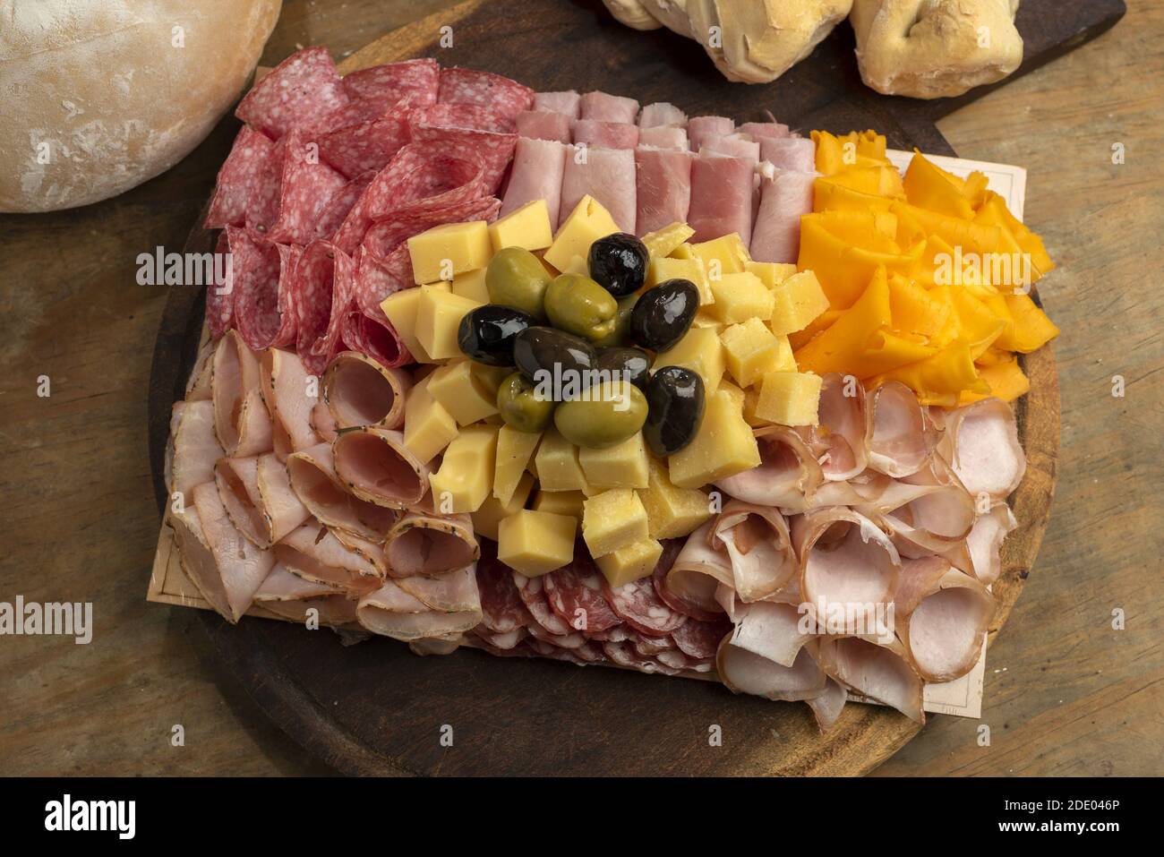 A high angle shot of a gourmet delicious charcuterie board with different meats and cheeses Stock Photo