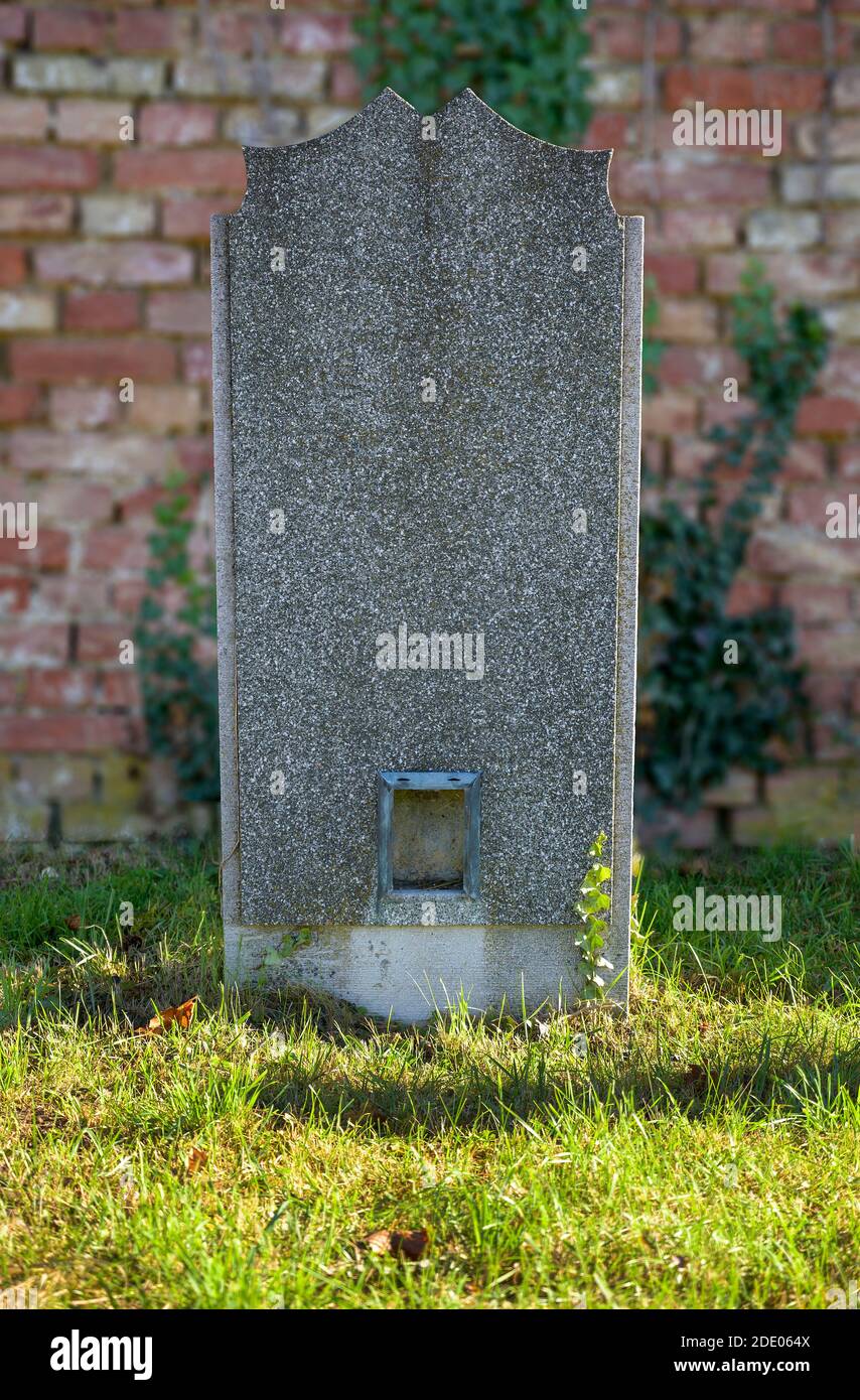 unlabeled old grave stone made from granite at the Viennese central cemetery, Austria Stock Photo