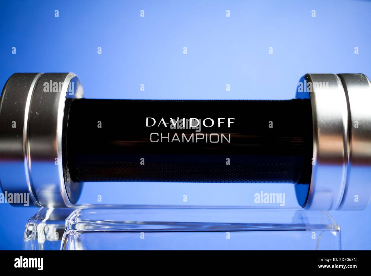 Viersen, Germany - May 9. 2020: Close up of isolated Davidoff champion men  perfume flacon in shape of dumbbell on glass, blue background Stock Photo -  Alamy