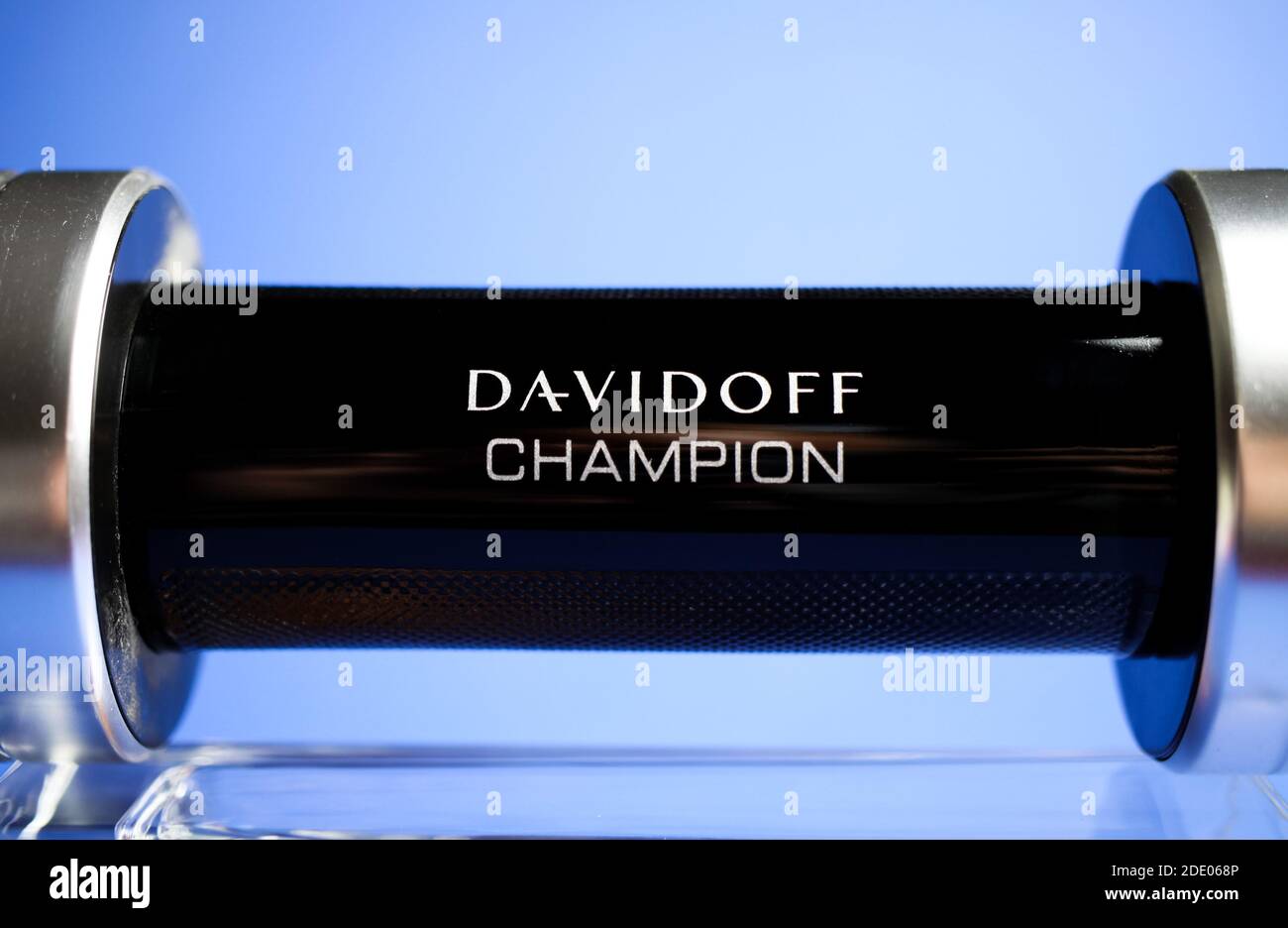 Viersen, Germany - May 9. 2020: Close up of isolated Davidoff champion men perfume flacon in shape of dumbbell glass, blue background Stock Photo -