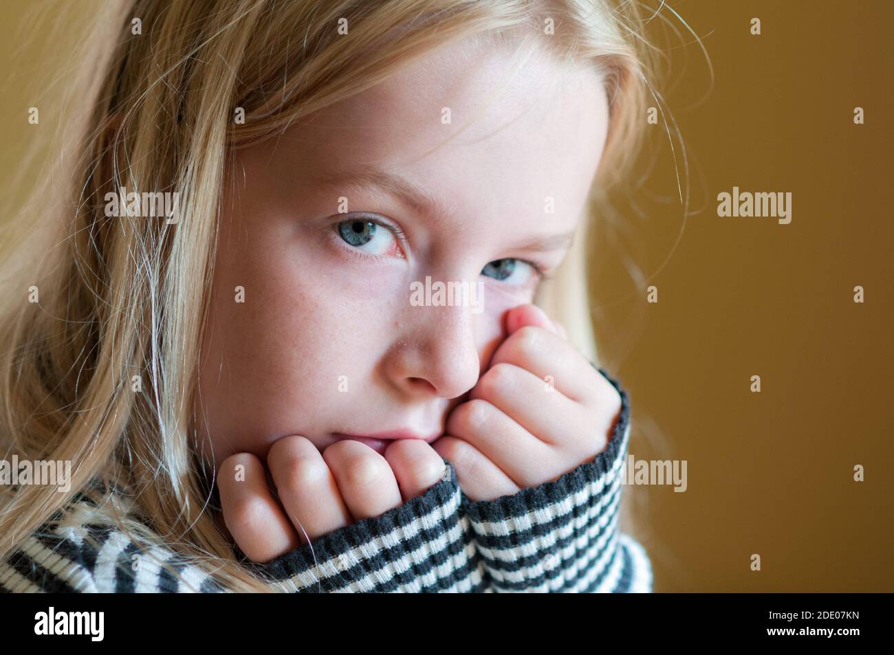 Close up portrait of a pretty young girl making eye contact with the camera Stock Photo Alamy