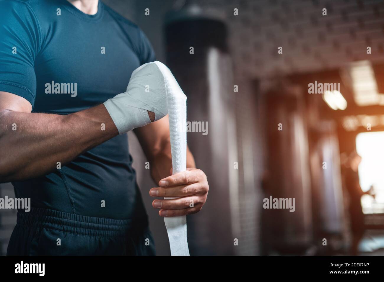 close up of boxer man bandage hand and preparing for training or