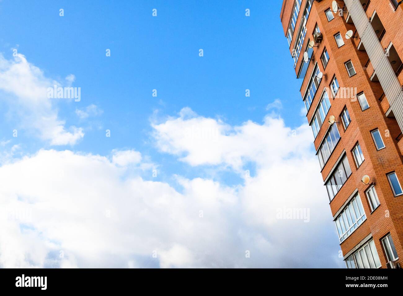 blue sky with white cloud and high-rise apartment building Stock Photo ...