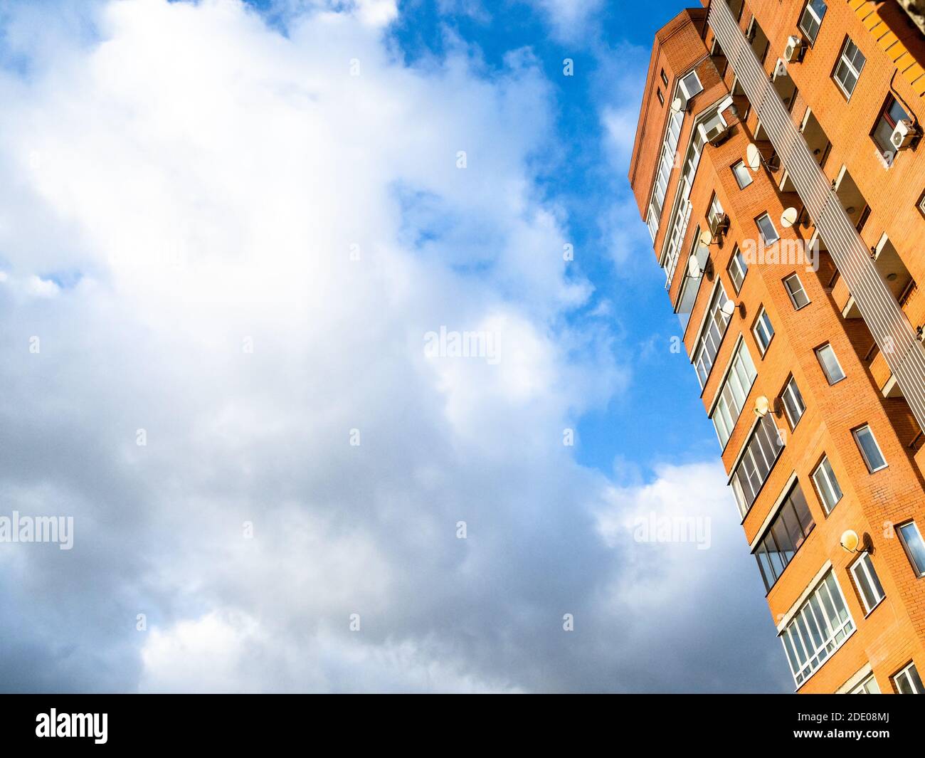 blue sky with white cloud and high-rise apartment house Stock Photo - Alamy