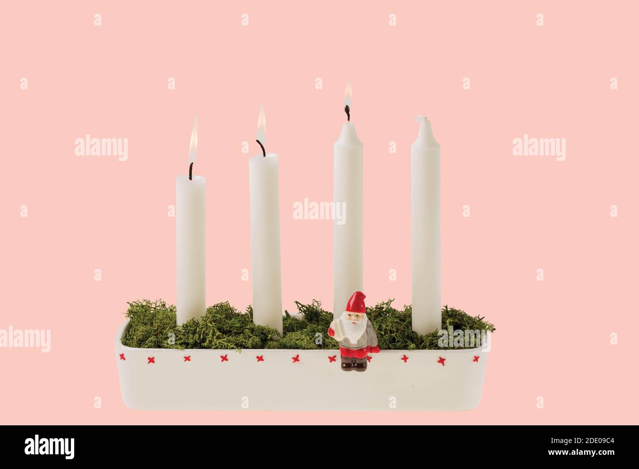 View of traditional advent candlestick with three lighted candle