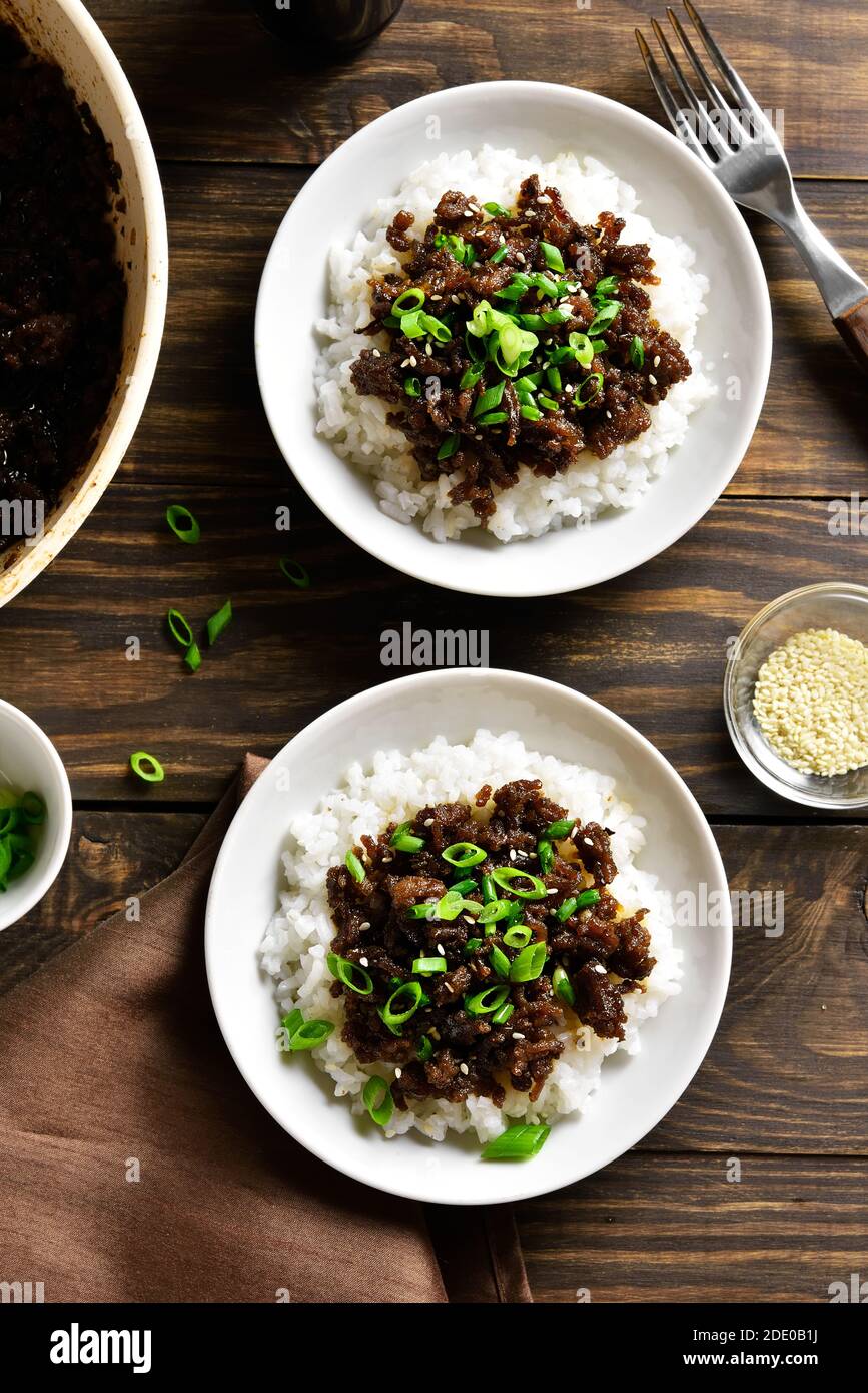 Korean ground beef and rice bowls on wooden background. Top view, flat ...