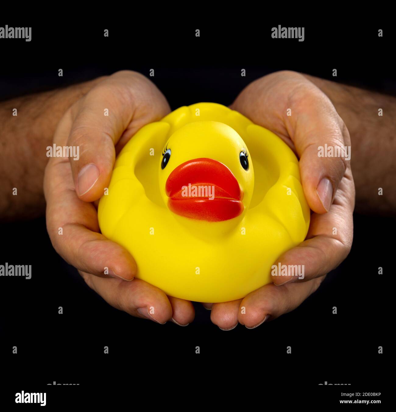 Yellow inflatable rubber duck in hands symbol of the Thai protests