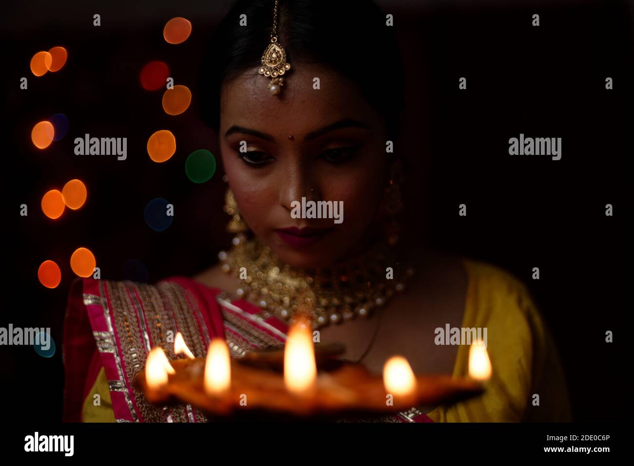 An young and beautiful Indian Bengali woman in Indian traditional dress
