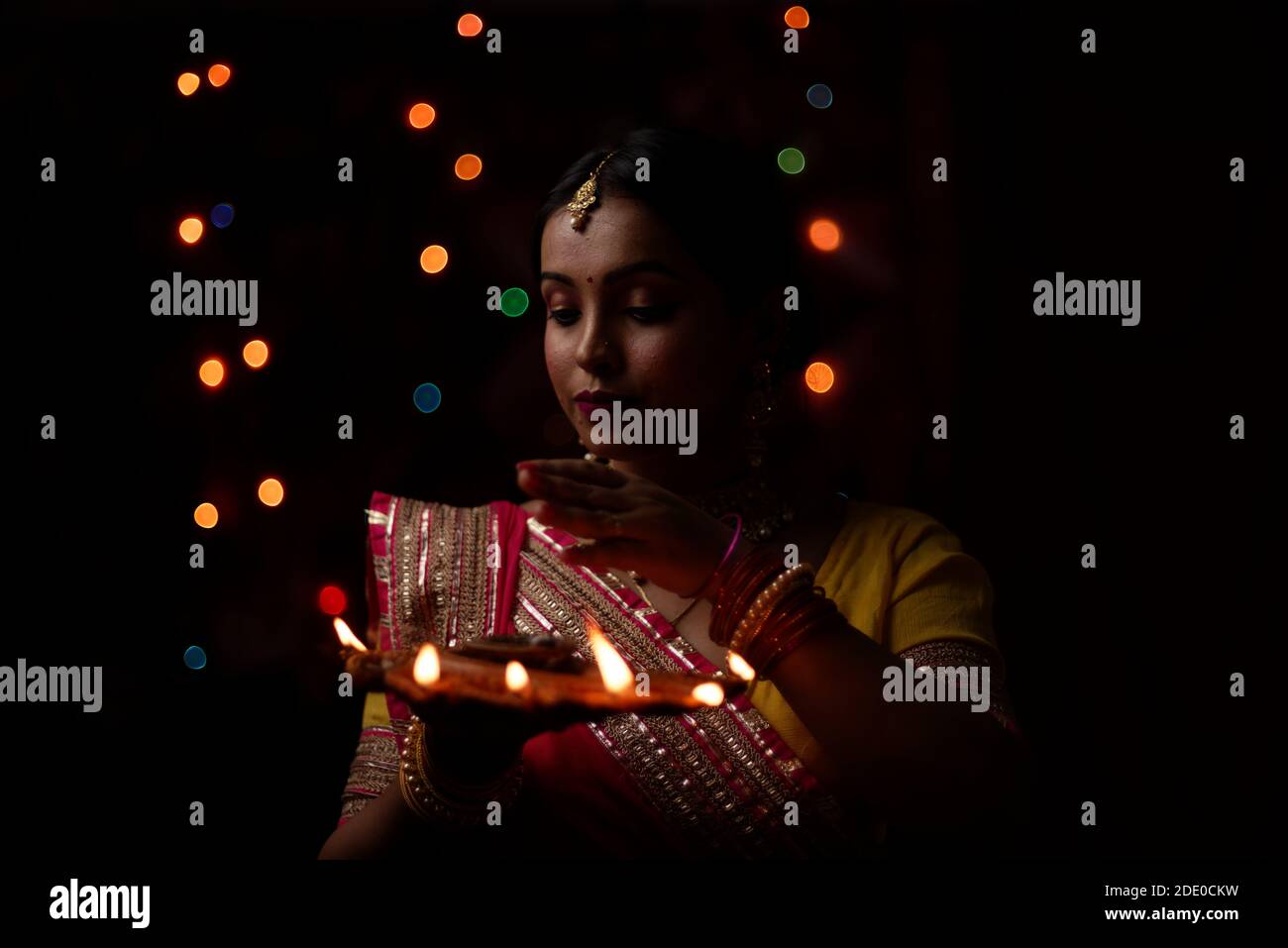 An young and beautiful Indian Bengali woman in Indian traditional dress