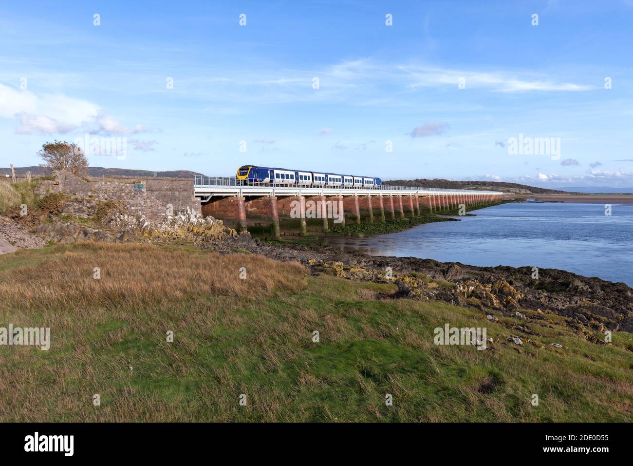Northern Rail CAF Civity  class 195 train 195109 crossing Levens viaduct on the Cumbrian coast railway line Stock Photo