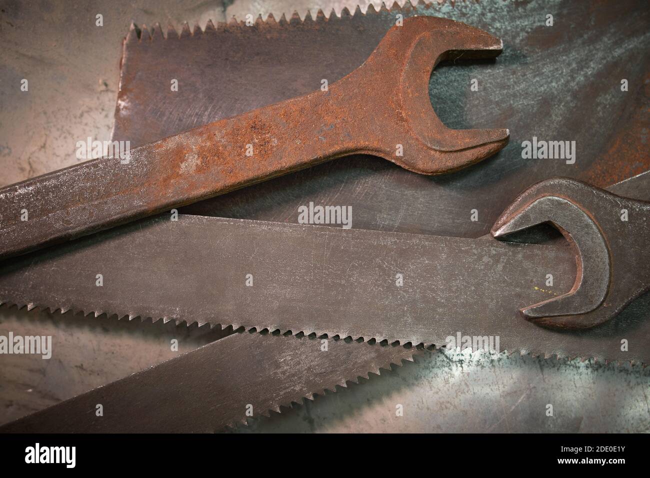 wrenches and hacksaw blades lie on a metal sheet Stock Photo Alamy