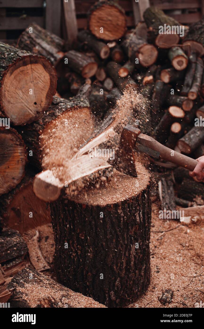 Wood shatters into pieces after ax chop Stock Photo