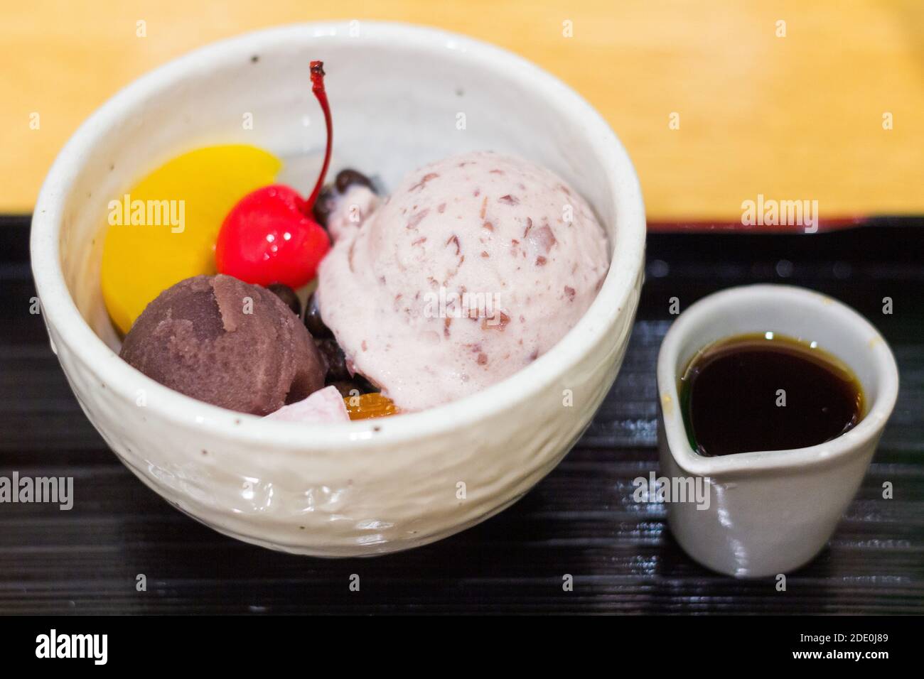 A bowl of ice cream and pieces of fruits in Tokyo, Japan Stock Photo