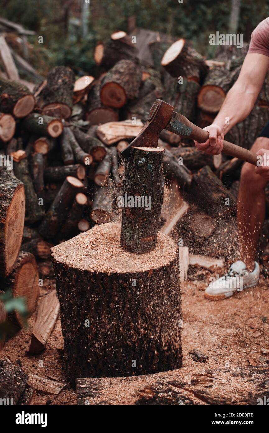 One big, muscly guy chop wood Stock Photo
