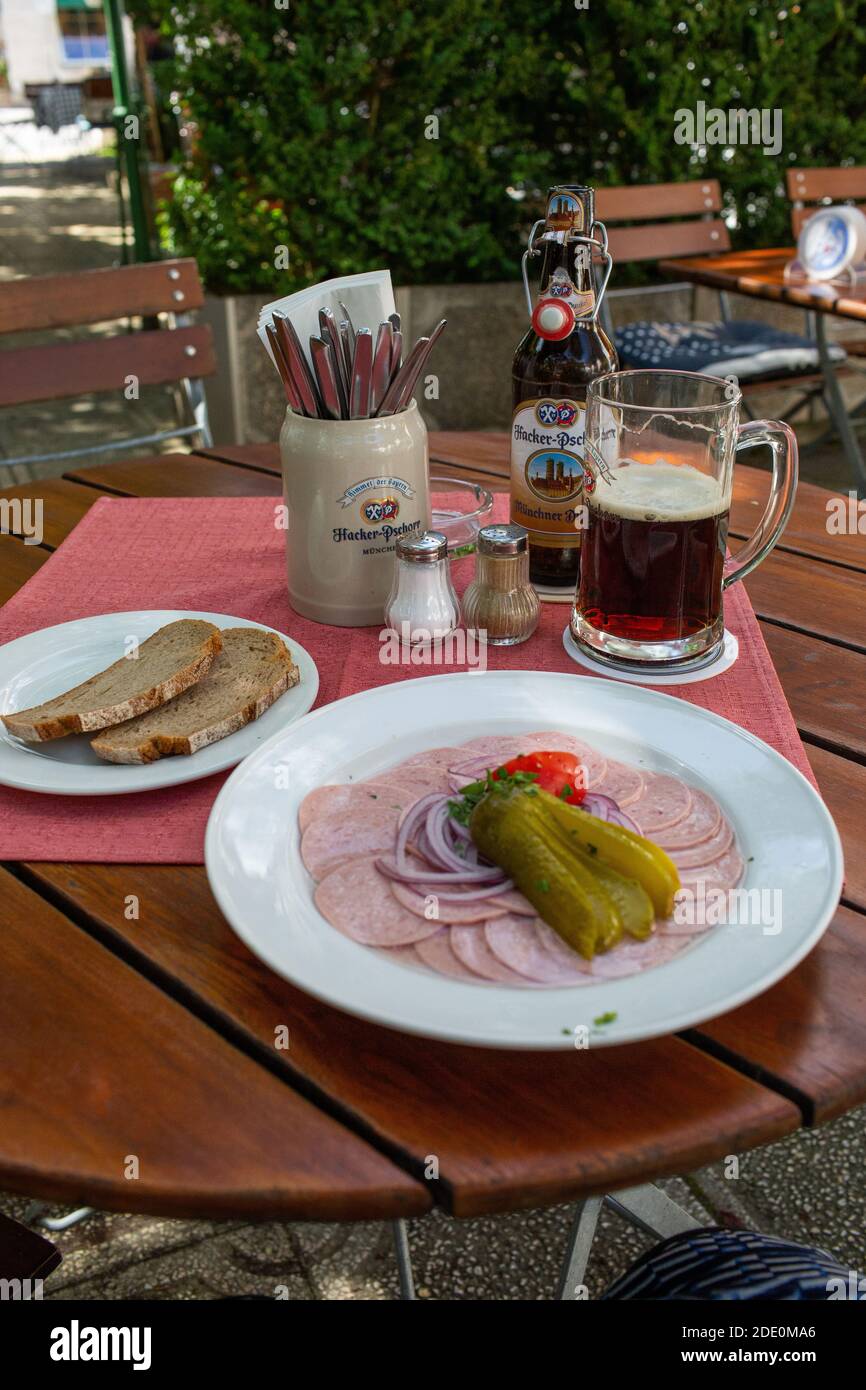 Wurstsalat and Bier - Sausage salad and beer in a bavarian beergarden, Germany Stock Photo