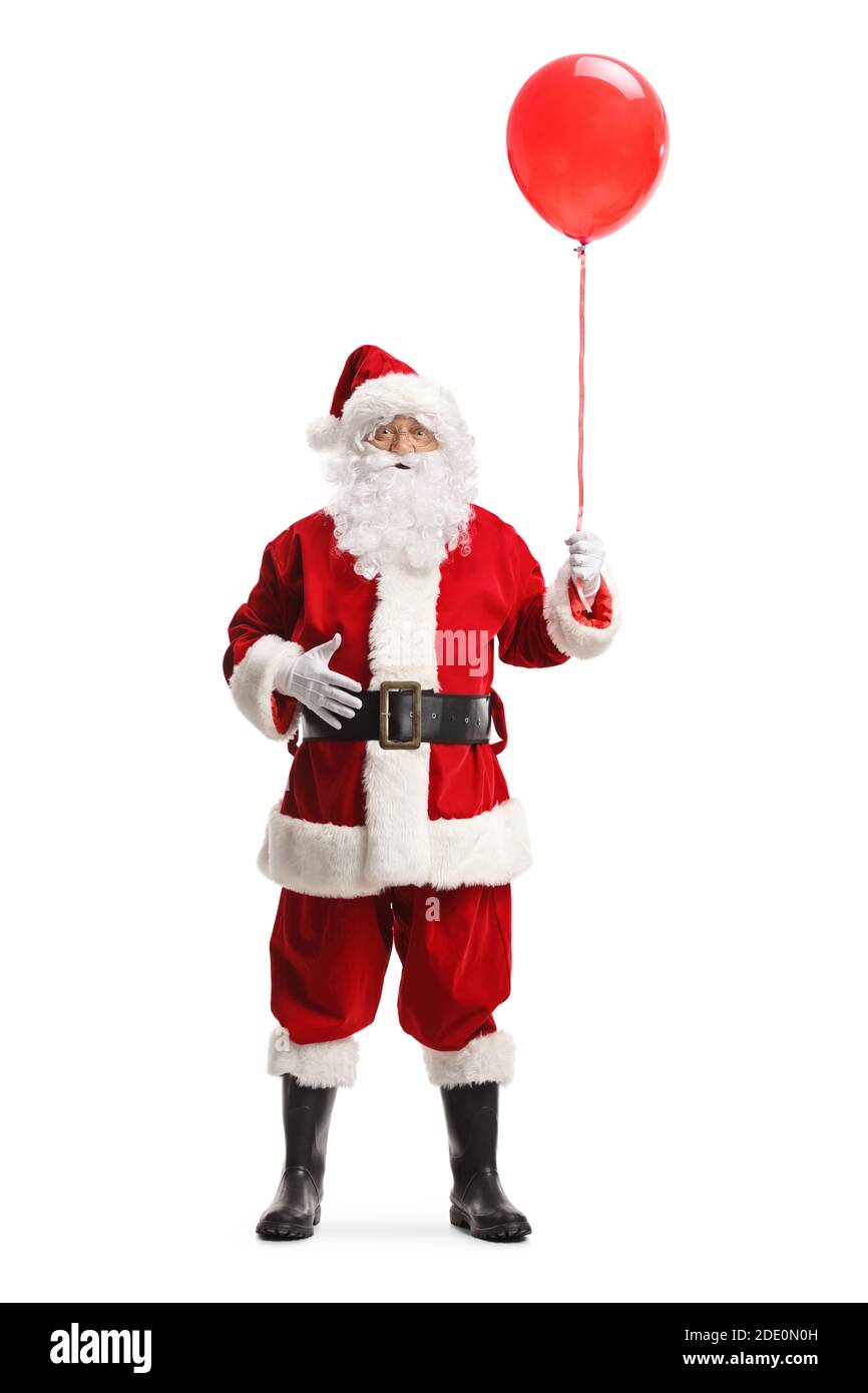 Full length portrait of santa claus holding a red balloon isolated on white background Stock Photo