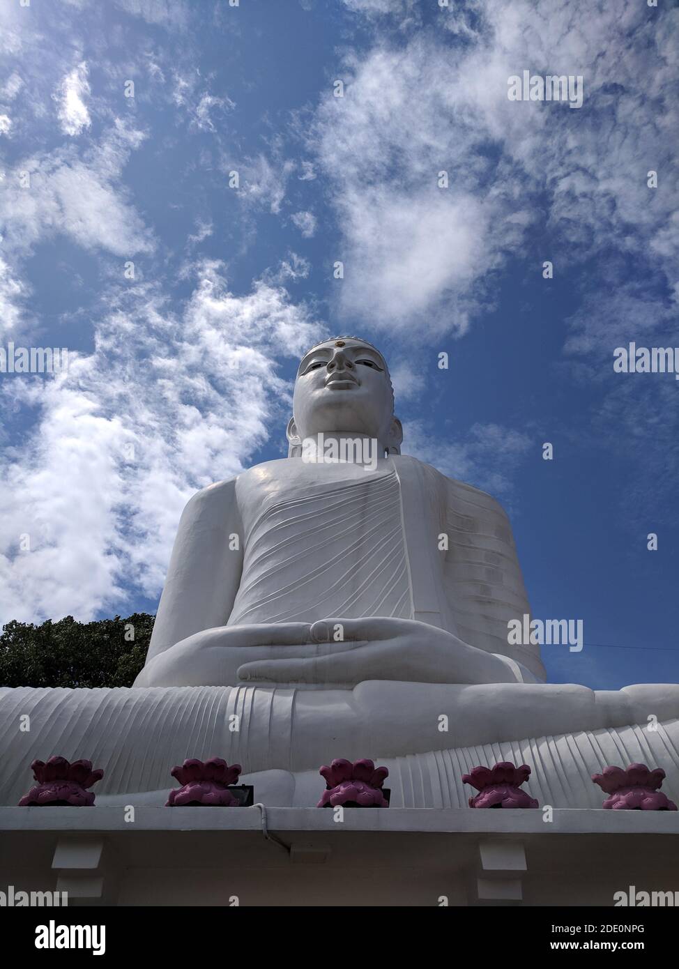 A low angle view of the Bahirawakanda Vihara Buddha Statue in Kandy Sri Lanka Stock Photo