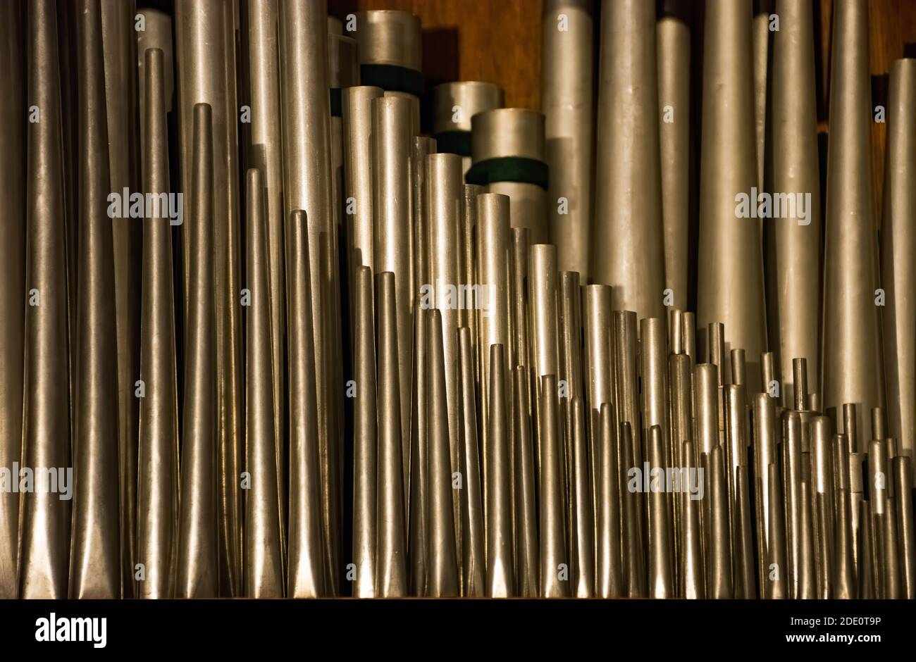 A historic pipe organ inside a church. Old musical instrument