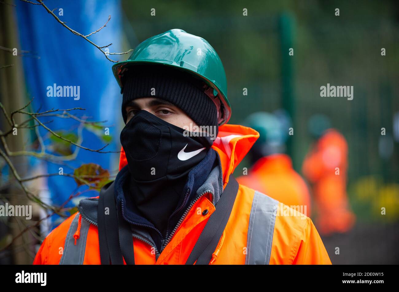 Denham, Buckinghamshire, UK. 27th November, 2020. Today HS2 workers and HS2 security entered the Denham Wildlife Protection Camp in Denham Country Park without permission. The camp is occupied by environmental activists who are living in trees next to an HS2 compound as they try to prevent HS2 from destroying the trees. HS2 arrived in the camp en mass and said it was so they could repair a fence between their compound and the activists camp. Credit: Maureen McLean/Alamy Live News Stock Photo