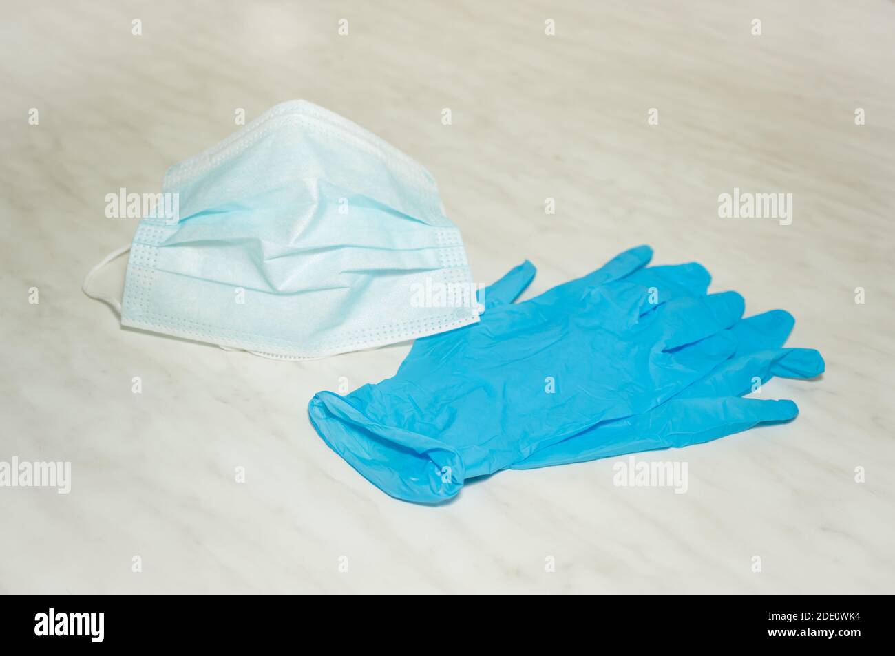 Personal protective equipment during the coronavirus pandemic - protective medical mask and gloves Stock Photo