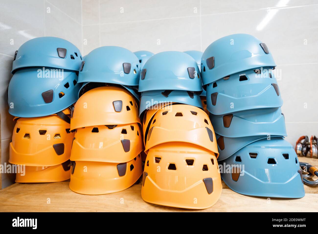 Hardhats and other safety equipment on the shelves at amusement park warehouse Stock Photo
