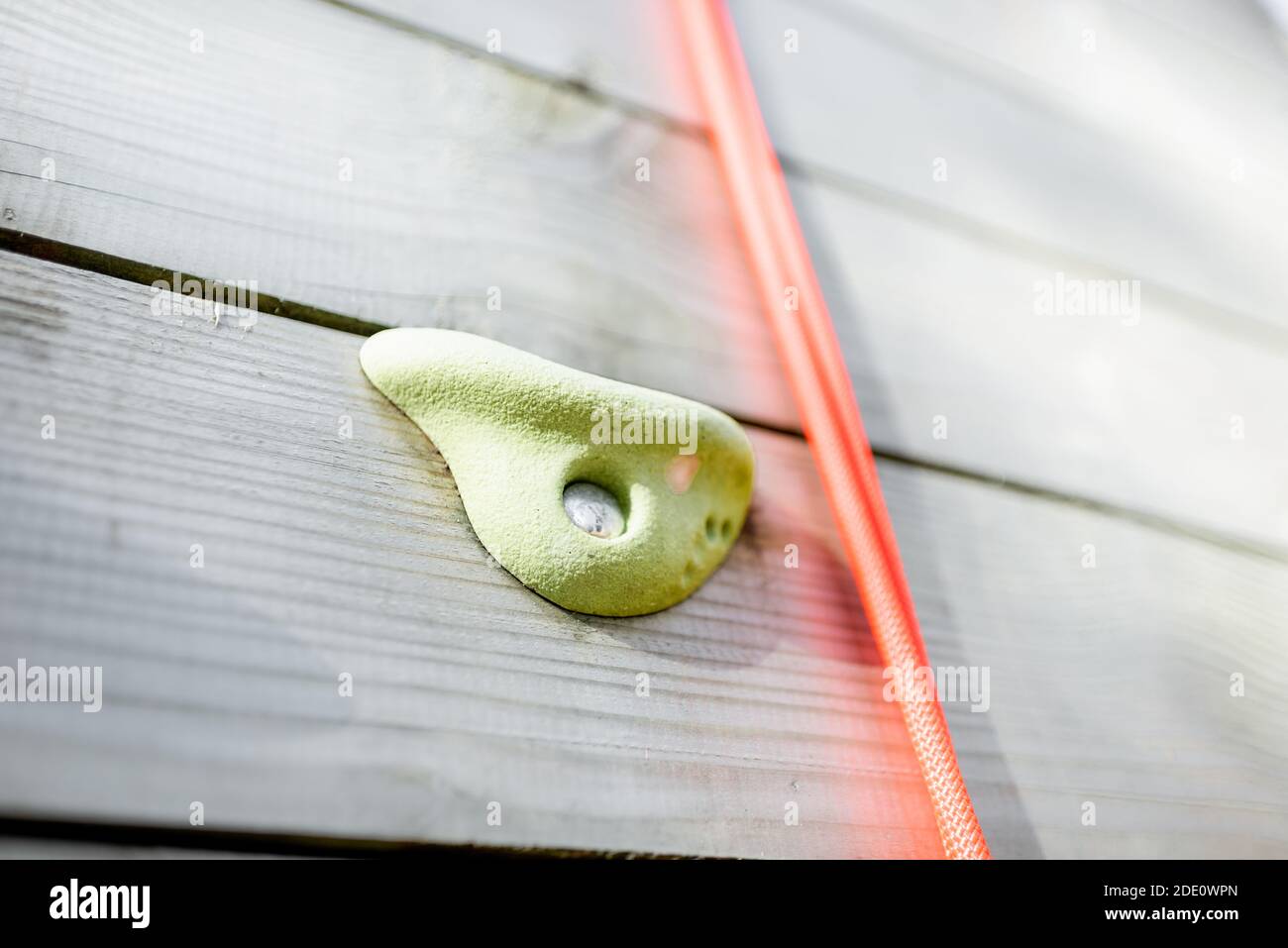 Climbing grips on the artificial climbing wall, closeup Stock Photo