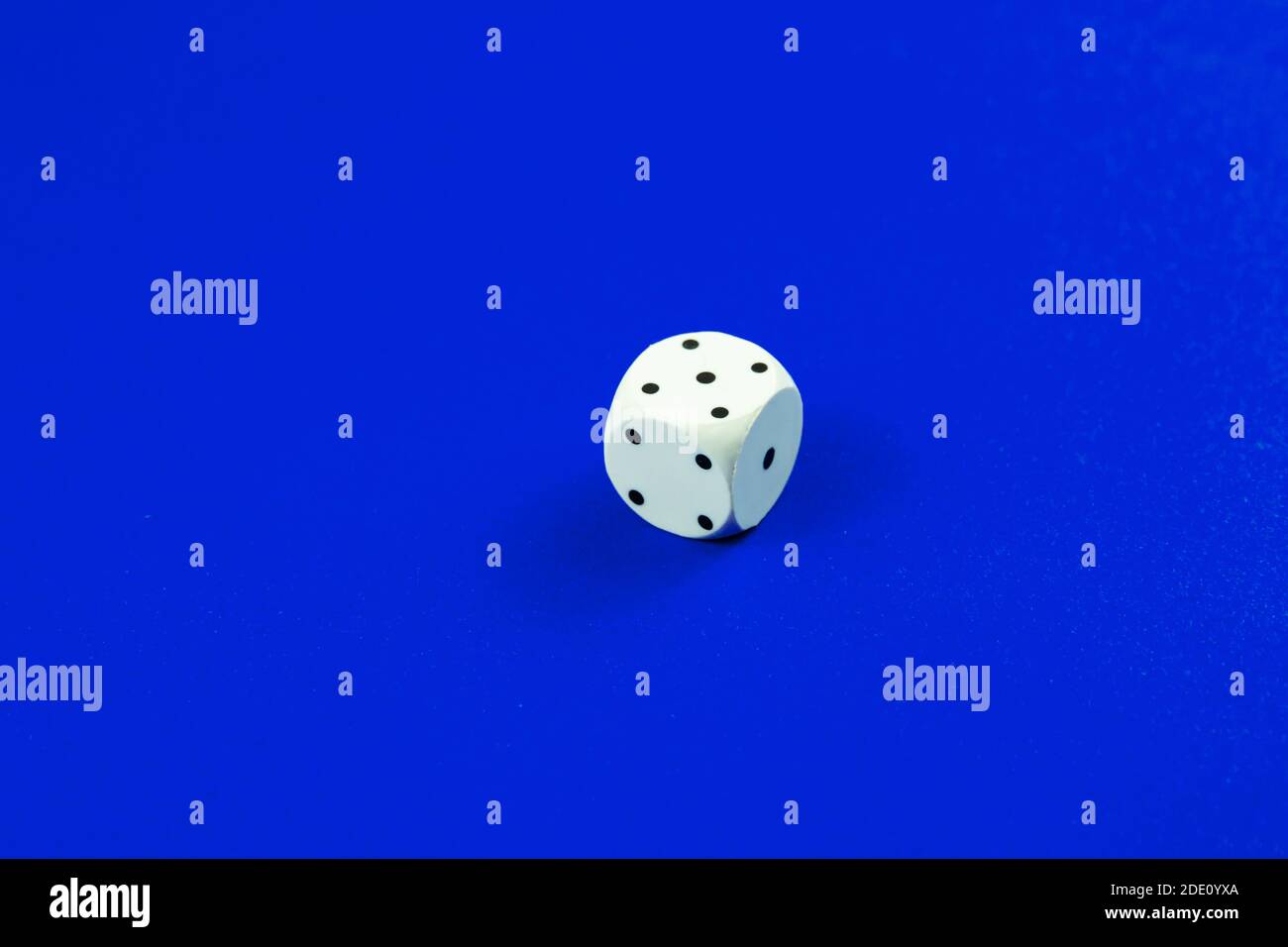 Dice macro photo on a plain monochrome background Stock Photo