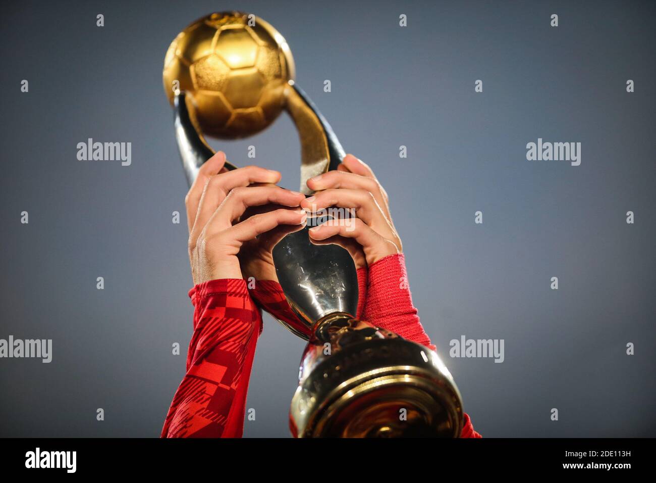 Cairo, Egypt. 27th Nov, 2020. Al Ahly's Kahraba holds up the trophy as his team celebrates winning the African Champions League Final soccer match against Zamalek at Cairo International Stadium. Credit: Samer Abdallah/dpa/Alamy Live News Stock Photo
