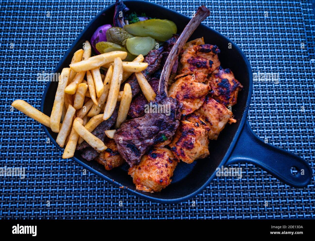 Turkish Traditional Ramadan Kebab Kofta with fries, onion, pickles and
