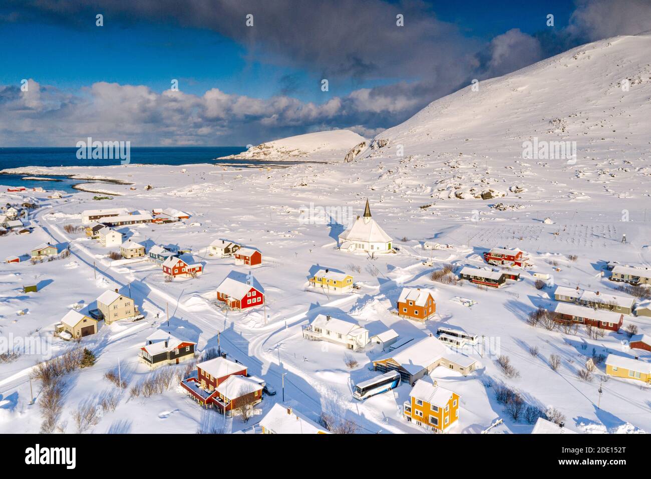 Aerial view of the fishing village of Hasvik covered with snow in