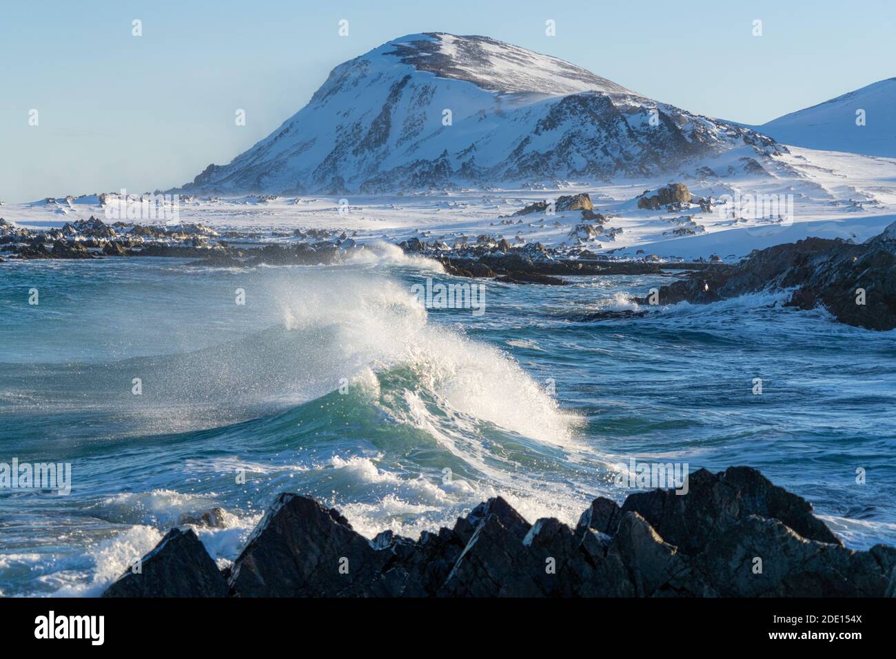 Waves of cold Barents Sea rising up before breaking on rocks, Sandfjorden, Arctic Ocean, Varanger Peninsula, Finnmark, Norway, Scandinavia, Europe Stock Photo