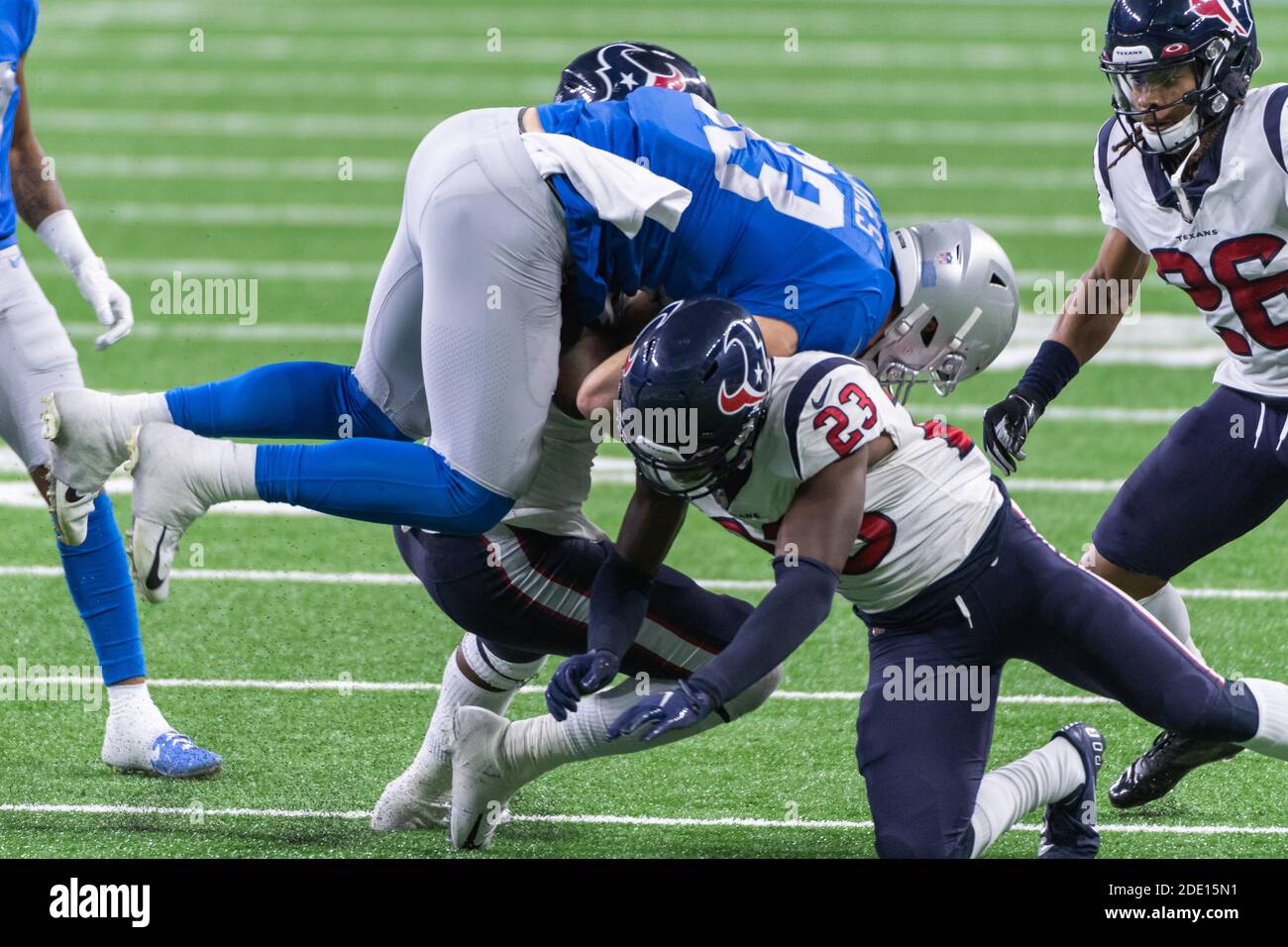 DETROIT, MI - NOVEMBER 26: Detroit Lions TE Jesse James (83) gets upended  by Houston Texans S Eric Murray (23) during NFL game between Houston Texans  and Detroit Lions on November 26,