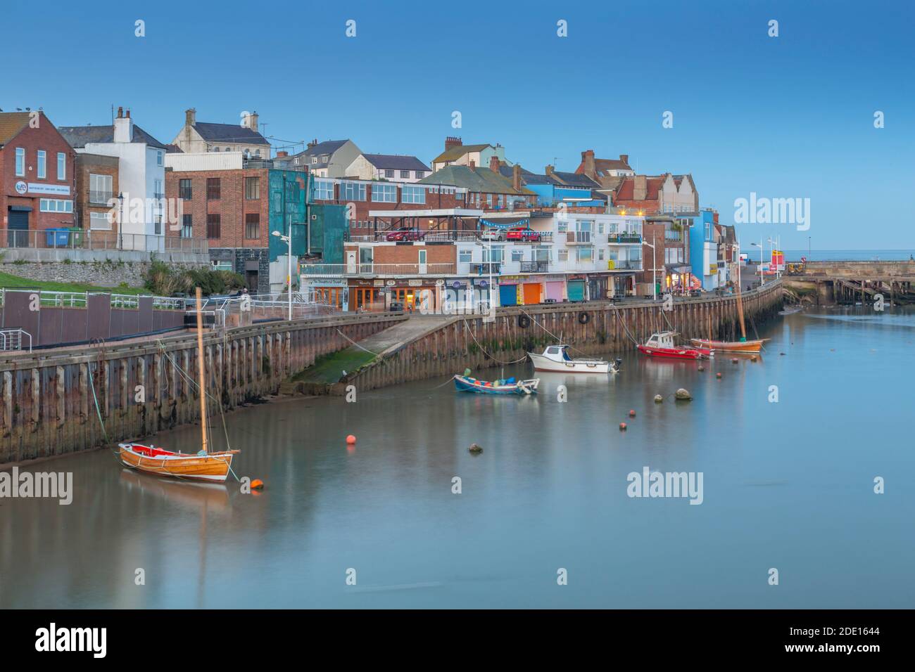 View of harbour boats and harbourside shops in Bridlington Harbour at