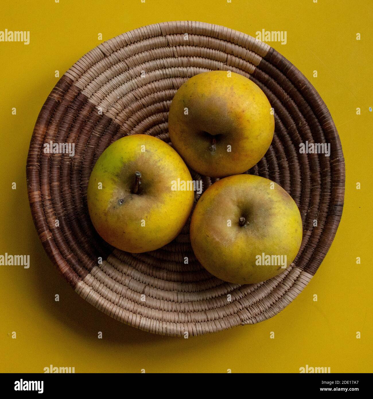 Orleans Reinette apples on wicker basket Stock Photo